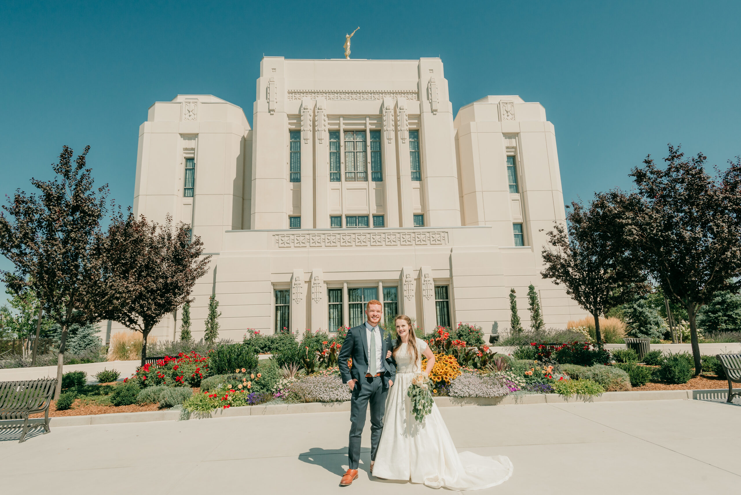 Bride and groom in front of Meridian temple in Idaho