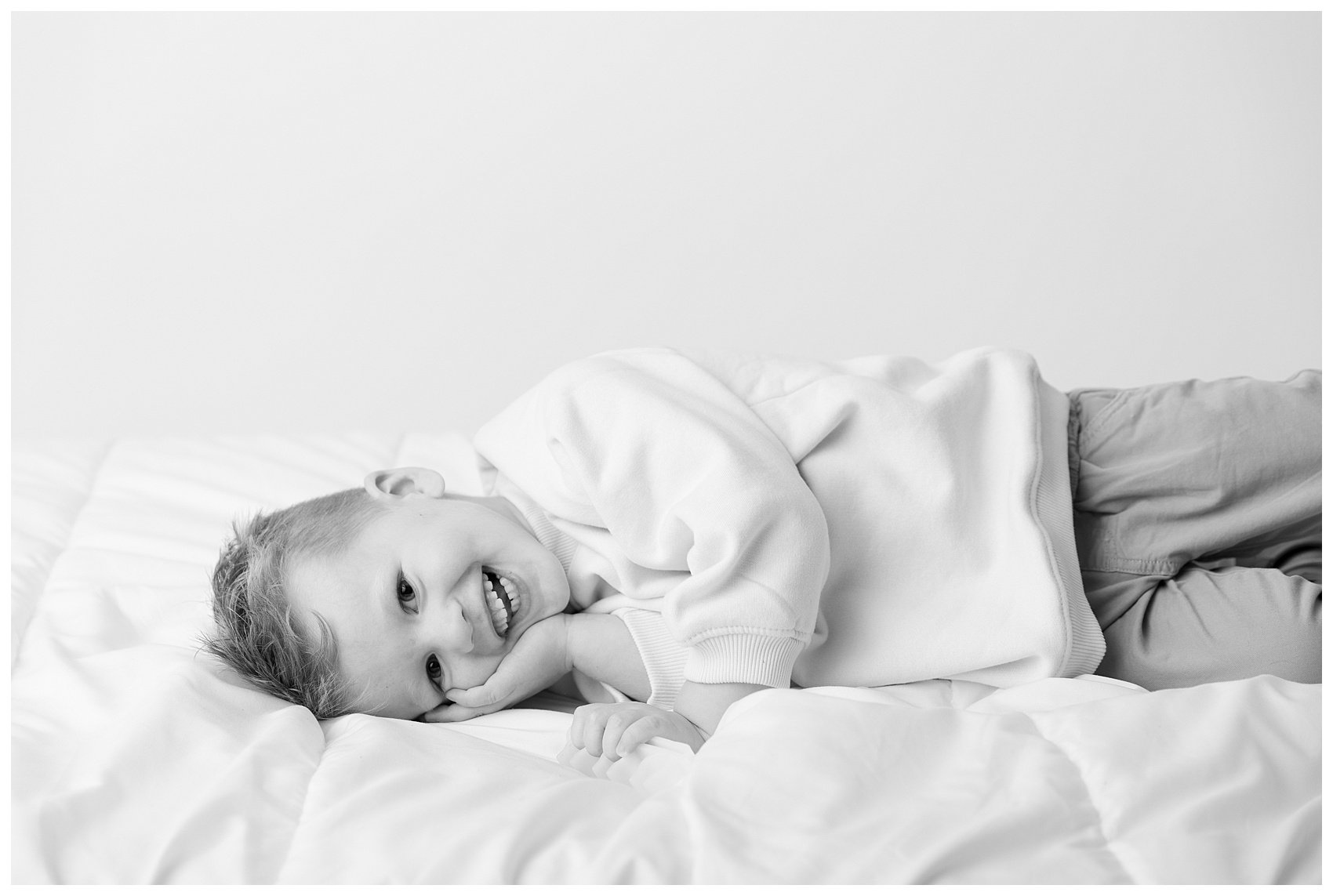 Session in all white studio in Draper, Utah. Child portrait photographed by Stephanie Lorraine Photography.