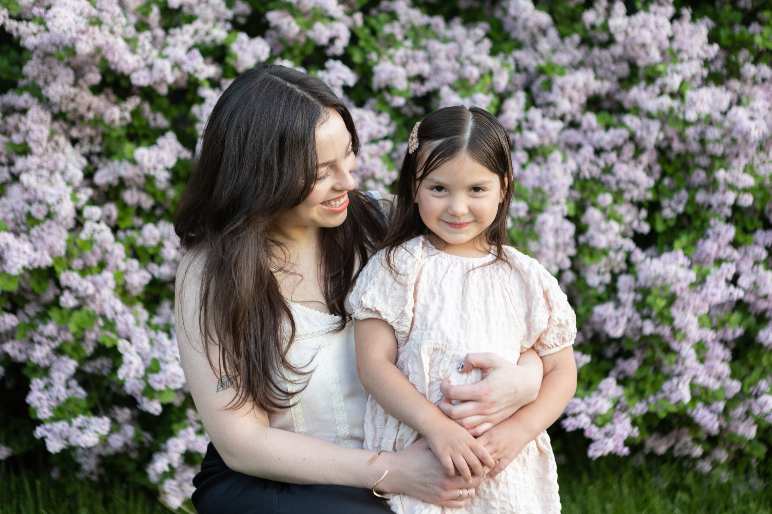 Mother and daughter family session on lavender wall
